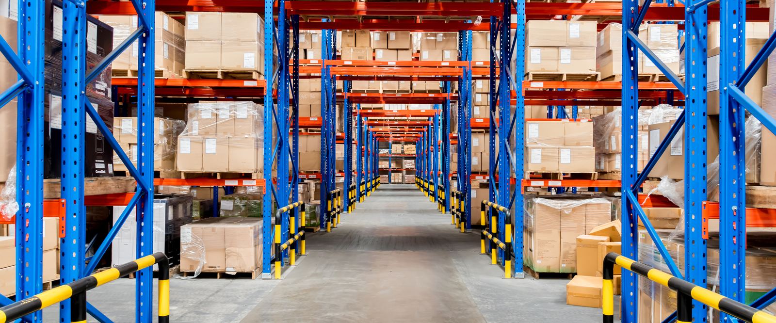 Distribution warehouse aisle with stocked pallet racking