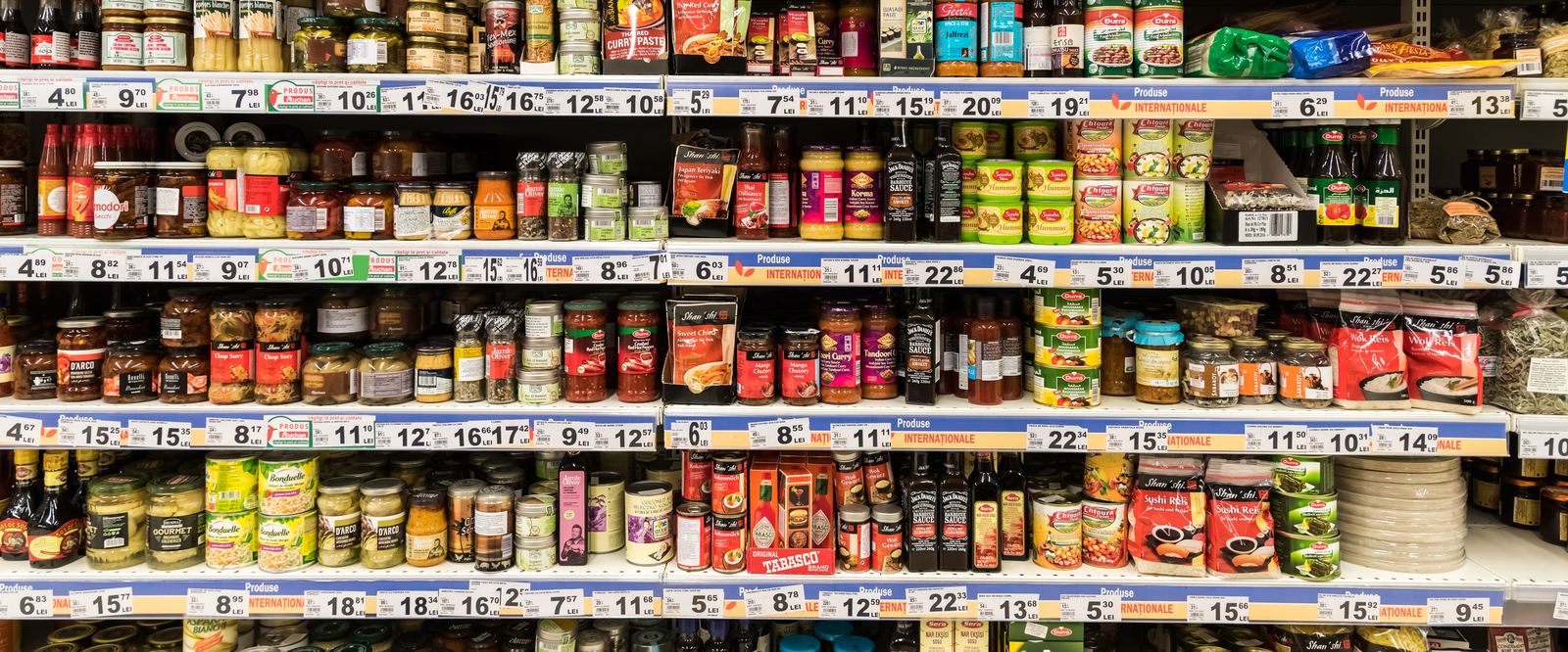Supermarket shelves with promotional price tickets