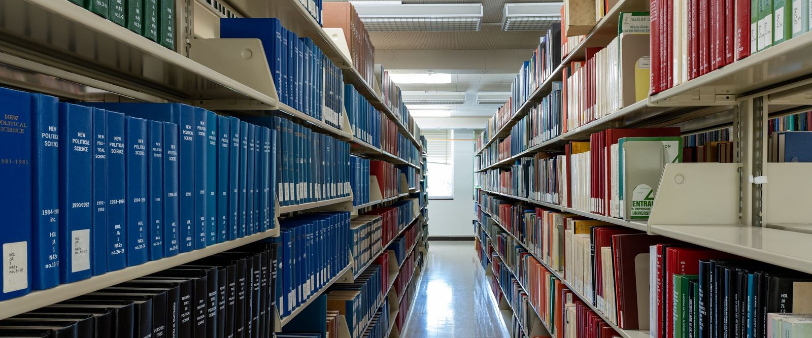 University library aisle lined with bound academic journals