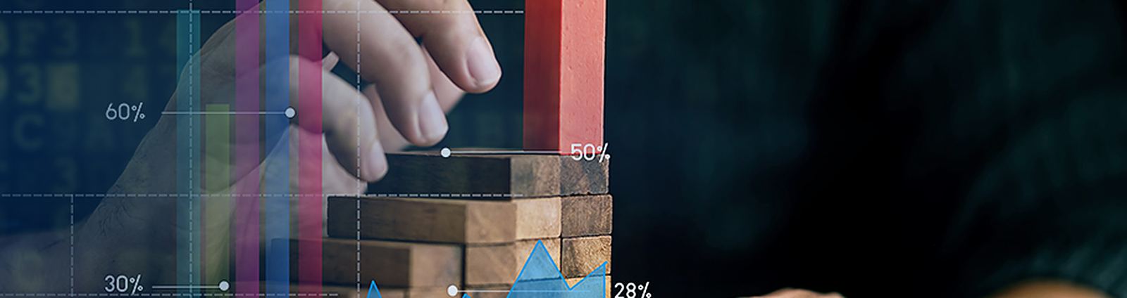 Hand stacking blocks over a growth chart